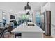 Modern kitchen features stainless appliances, center island and an open floor plan at 6890 Peachtree Dunwoody Rd # 303, Atlanta, GA 30328