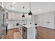 Modern kitchen with white cabinetry, stainless steel appliances, and island with seating at 6890 Peachtree Dunwoody Rd # 303, Atlanta, GA 30328