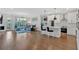 Bright and airy living room featuring hardwood floors, comfortable seating, and a modern ceiling fan at 6890 Peachtree Dunwoody Rd # 303, Atlanta, GA 30328