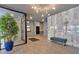 Modern lobby area with sleek tile flooring, marble accent wall, and comfortable seating at 6890 Peachtree Dunwoody Rd # 303, Atlanta, GA 30328