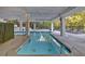 Outdoor pool area with lounge chairs and lush landscaping at 6890 Peachtree Dunwoody Rd # 303, Atlanta, GA 30328