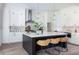 Modern kitchen with white cabinets, large island, and stainless steel appliances at 64 Telfair Ct, Acworth, GA 30101