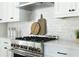 White kitchen with a gas range and white subway tile backsplash at 64 Telfair Ct, Acworth, GA 30101