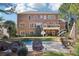 View of the backyard featuring a pool, patio seating, lush lawn and a brick house at 3950 Stanford Dr, Cumming, GA 30041