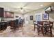 Entertaining bar area featuring dark wood cabinets, bar stools and a flat screen TV mounted to the wall at 3950 Stanford Dr, Cumming, GA 30041