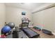 Basement gym featuring a treadmill, weight bench, and tv at 3950 Stanford Dr, Cumming, GA 30041