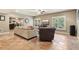 Basement living room featuring couches, tv, and access to kitchen at 3950 Stanford Dr, Cumming, GA 30041
