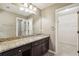 Bathroom featuring granite counters, large mirror, and open closet space at 3950 Stanford Dr, Cumming, GA 30041