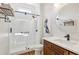 Modern bathroom with glass shower, quartz countertop, and a contemporary design at 3950 Stanford Dr, Cumming, GA 30041