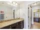 Bathroom featuring granite counters, large mirror, and double vanity at 3950 Stanford Dr, Cumming, GA 30041