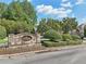Stone entrance sign for Southgate Village at Windermere, surrounded by manicured landscaping at 3950 Stanford Dr, Cumming, GA 30041
