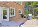 Wooden deck featuring a grill, patio furniture with covers, and views of trees at 3950 Stanford Dr, Cumming, GA 30041