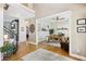 Inviting foyer with hardwood floors, a view of the home office, and a staircase leading to the second floor at 3950 Stanford Dr, Cumming, GA 30041