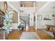 Inviting foyer with hardwood floors and an open staircase at 3950 Stanford Dr, Cumming, GA 30041
