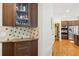 Kitchen area featuring wood cabinets, granite countertops, and stainless steel appliances, perfect for cooking and entertaining at 3950 Stanford Dr, Cumming, GA 30041