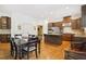 Spacious kitchen featuring stainless steel appliances, granite countertops, and dark wood cabinetry at 3950 Stanford Dr, Cumming, GA 30041