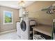 Convenient laundry room with front-load washer and dryer, plus utility sink at 3950 Stanford Dr, Cumming, GA 30041