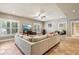 Expansive living room with recessed lights, hardwood flooring, comfortable sectional couch and a full entertainment center at 3950 Stanford Dr, Cumming, GA 30041