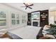 Inviting living room featuring a cozy fireplace, custom built-ins, and plantation shutters for ample natural light at 3950 Stanford Dr, Cumming, GA 30041
