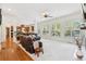 Bright living room with large windows, fireplace, and open to the kitchen, perfect for entertaining at 3950 Stanford Dr, Cumming, GA 30041