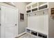 Functional mudroom with built-in bench, storage cubbies, and coat hooks, providing organized entry space at 3950 Stanford Dr, Cumming, GA 30041
