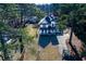 Aerial view of a two-story house and surrounding land at 8404 Majors Rd, Cumming, GA 30041