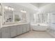 Luxurious bathroom with double vanity, soaking tub, and walk-in shower at 1055 Downing Ne Ct, Marietta, GA 30068