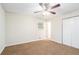 Bright bedroom featuring ceiling fan and ample closet space at 1512 Pine Glen Cir, Decatur, GA 30035