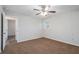 Well-lit bedroom with ceiling fan and access to another room at 1512 Pine Glen Cir, Decatur, GA 30035