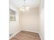 Small dining area with chandelier and hardwood floors at 1512 Pine Glen Cir, Decatur, GA 30035