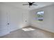 Bright bedroom with carpet flooring, double doors, and a window at 520 Mountainview Dr, Covington, GA 30016