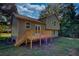 Rear view of house showing deck and green siding at 520 Mountainview Dr, Covington, GA 30016