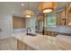 Bright kitchen boasts an island with quartz countertops, stainless steel appliances, and light wood cabinets at 520 Mountainview Dr, Covington, GA 30016