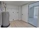 Laundry area with vinyl flooring, water heater and shelving at 520 Mountainview Dr, Covington, GA 30016