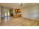 Spacious living room with light wood flooring and access to the kitchen at 520 Mountainview Dr, Covington, GA 30016