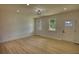 Bright living room with light wood flooring and a white front door at 520 Mountainview Dr, Covington, GA 30016