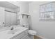 Simple bathroom with a single vanity, toilet and shower/tub combo at 718 Creek Nw Trl, Kennesaw, GA 30144