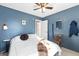 Serene bedroom with a queen bed, wall hooks, and a calming blue palette at 718 Creek Nw Trl, Kennesaw, GA 30144