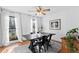 Charming dining room with a rustic wood table and black metal chairs at 718 Creek Nw Trl, Kennesaw, GA 30144