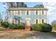 Two-story house with blue siding, beige shutters, and a manicured lawn at 718 Creek Nw Trl, Kennesaw, GA 30144