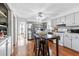 Modern kitchen with stainless steel appliances and light gray cabinets at 718 Creek Nw Trl, Kennesaw, GA 30144