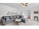 Bright living room featuring a comfortable sectional sofa and a stylish coffee table at 718 Creek Nw Trl, Kennesaw, GA 30144