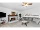 Living room with L-shaped sofa and fireplace at 718 Creek Nw Trl, Kennesaw, GA 30144