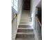 Carpeted staircase with wooden railings leading to the upper level at 3954 Riverside Pkwy, Decatur, GA 30034