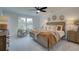 Beautiful bedroom with a large window, ceiling fan, decorative wall hangings and neutral decor at 405 Carrera Ln, Acworth, GA 30102