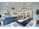 Open concept dining room with modern chandelier and seating for six at 405 Carrera Ln, Acworth, GA 30102