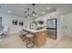 Contemporary kitchen island with seating, stainless steel appliances, and white cabinets for a modern touch at 405 Carrera Ln, Acworth, GA 30102