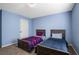 Bedroom with two twin beds and blue walls at 1252 Thomas Daniel Way, Lawrenceville, GA 30045