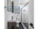 Contemporary bathroom featuring a glass-enclosed shower, modern fixtures, and stylish tile work with herringbone pattern at 2240 Cheshire Bridge Rd # 205, Atlanta, GA 30324