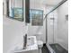 Modern bathroom features a glass-enclosed shower with herringbone tile and a sleek vanity at 2240 Cheshire Bridge Rd # 205, Atlanta, GA 30324